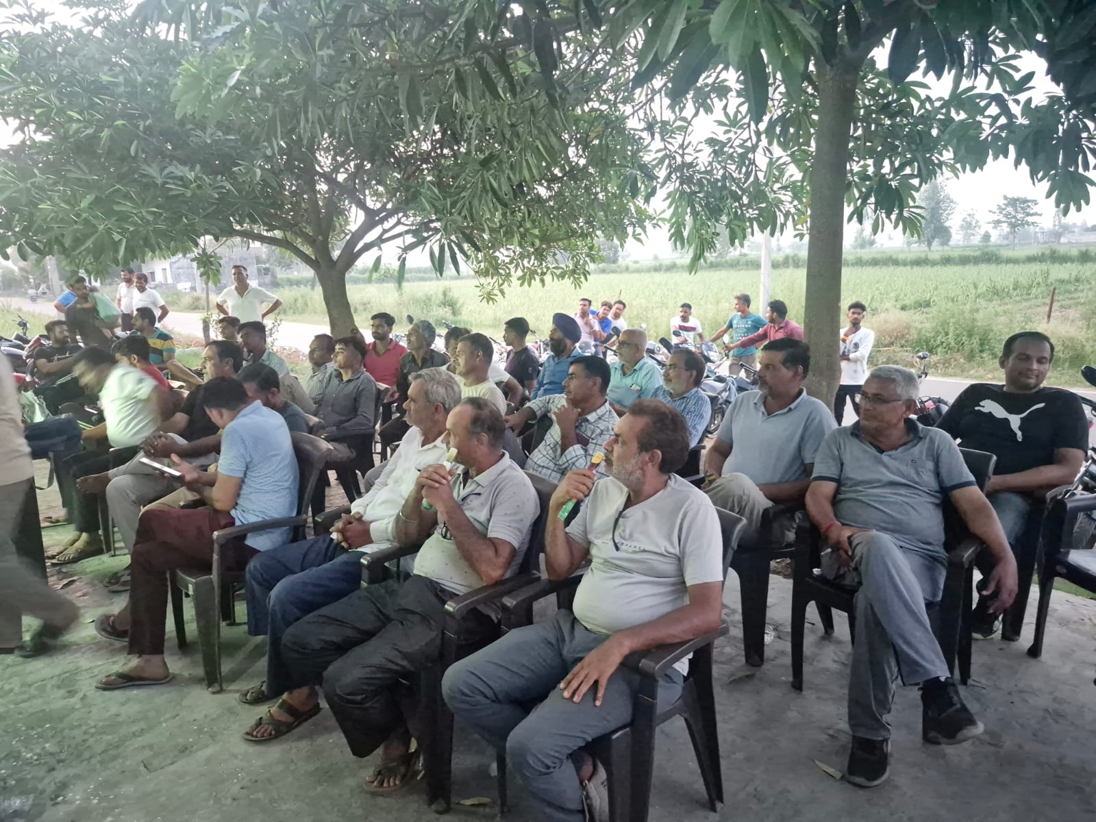 Farmers attending a village agricultural meeting
